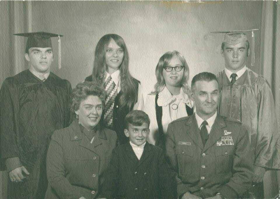 Photograph of family dressed formally and in military uniform
