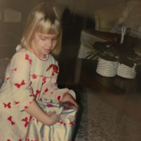 girl opening Christmas present