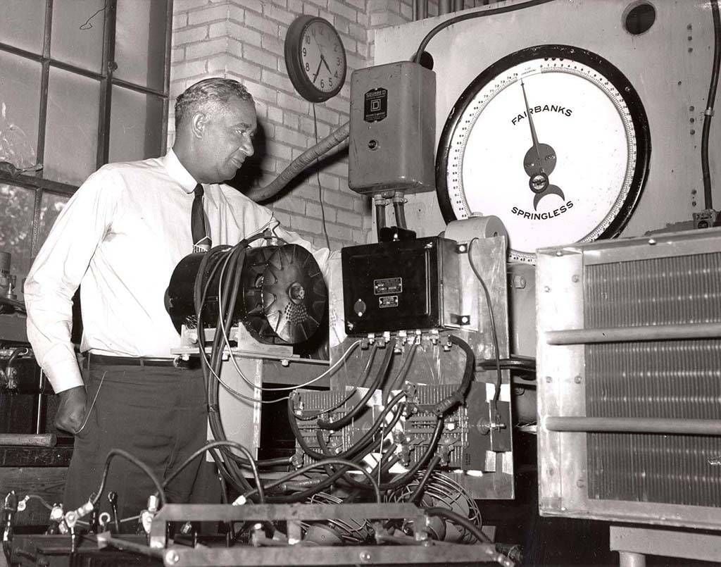 Black and white photo of Fred Jones with machinery