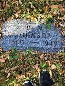 Headstone engraved with the words Ida M Johnson 1860-1949