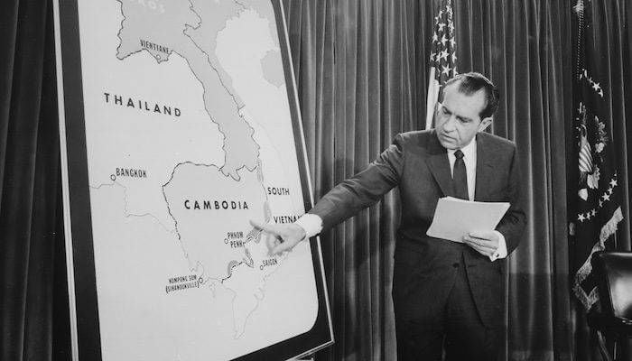 Richard Nixon pointing at a map of Cambodia