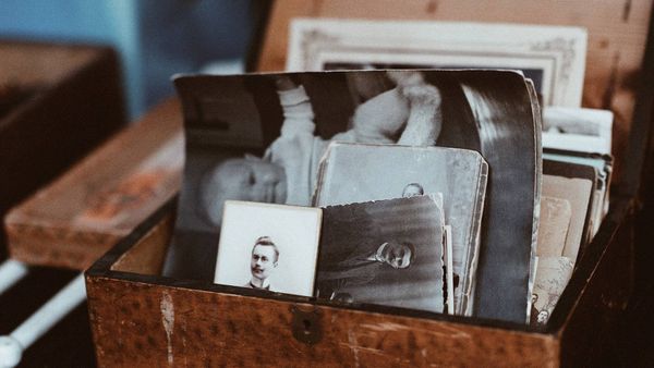 Drawer stuffed with old black and white photographs
