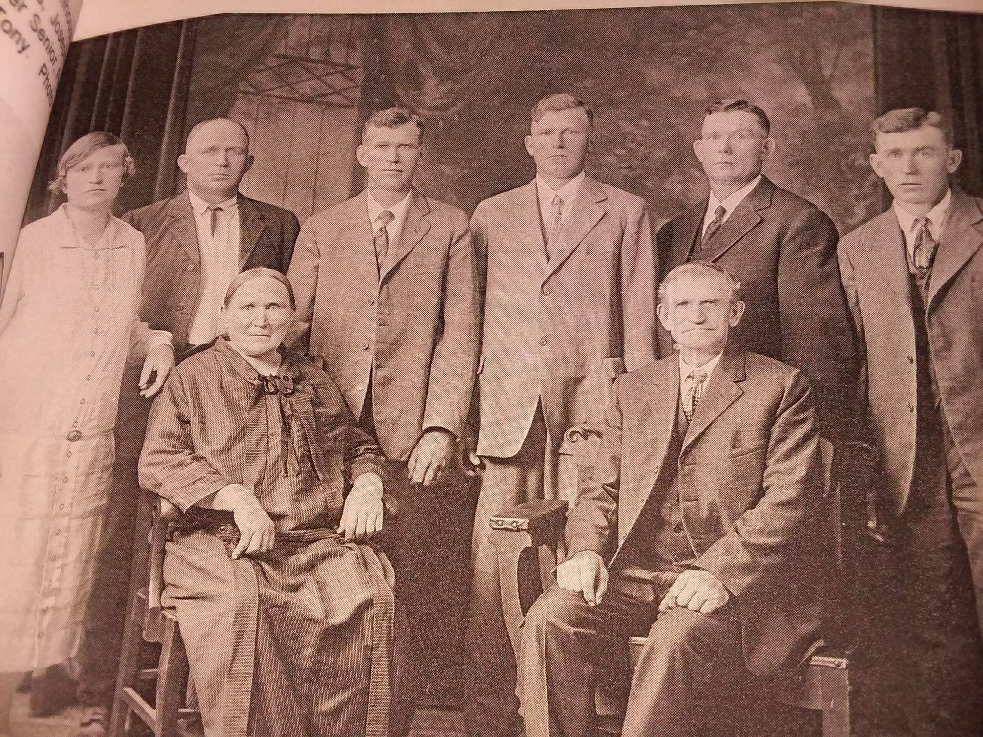 Group of 8 people dressed in formal clothes