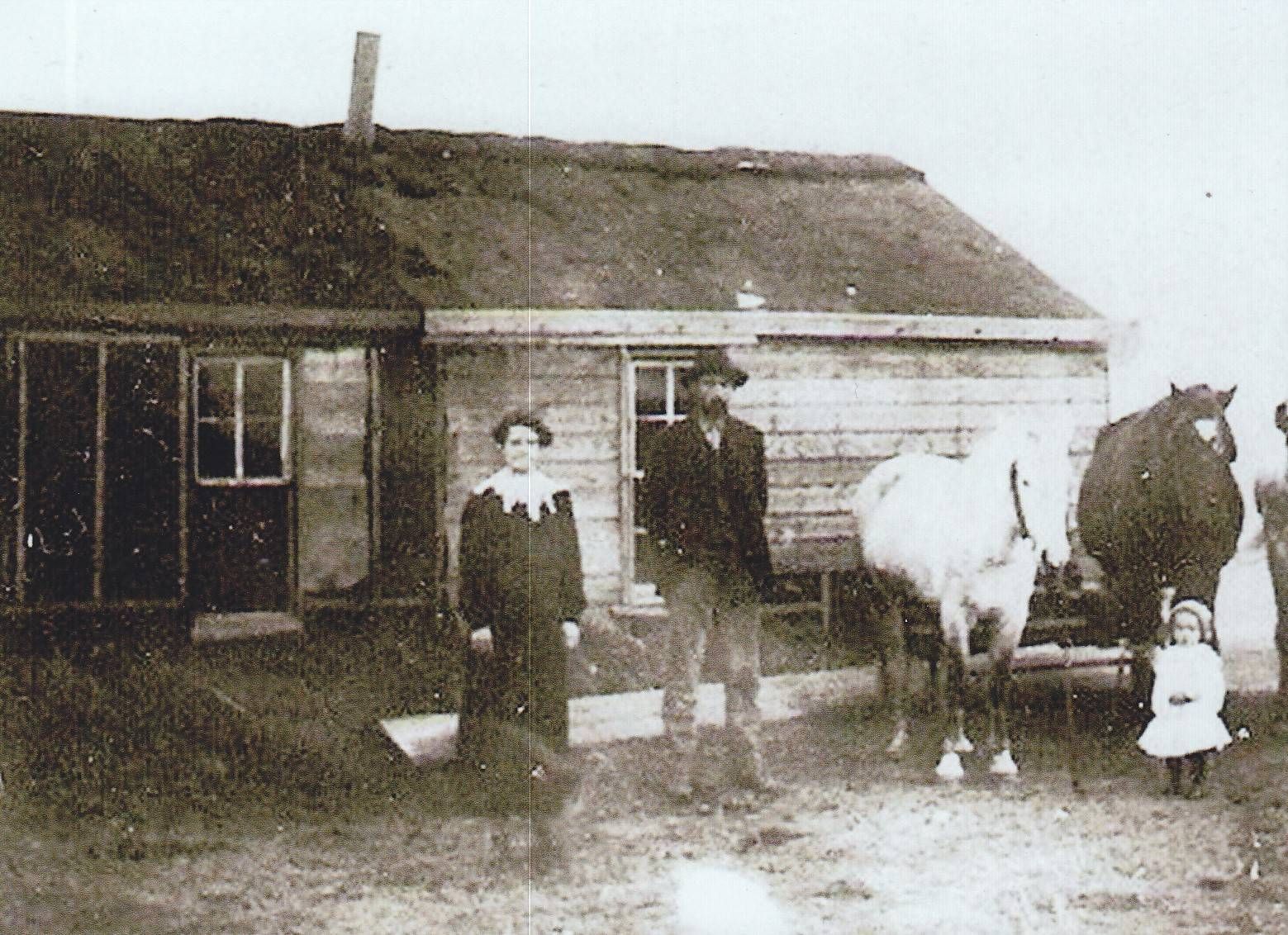 Palmer James, Emily and Elmo McQuillen, homestead near Wildrose, ND 1908.