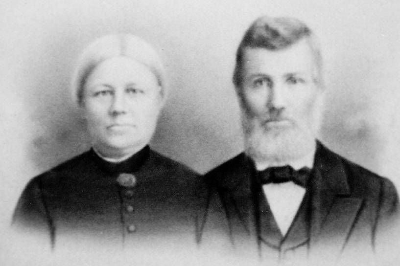 Photo of man and woman wearing black jackets