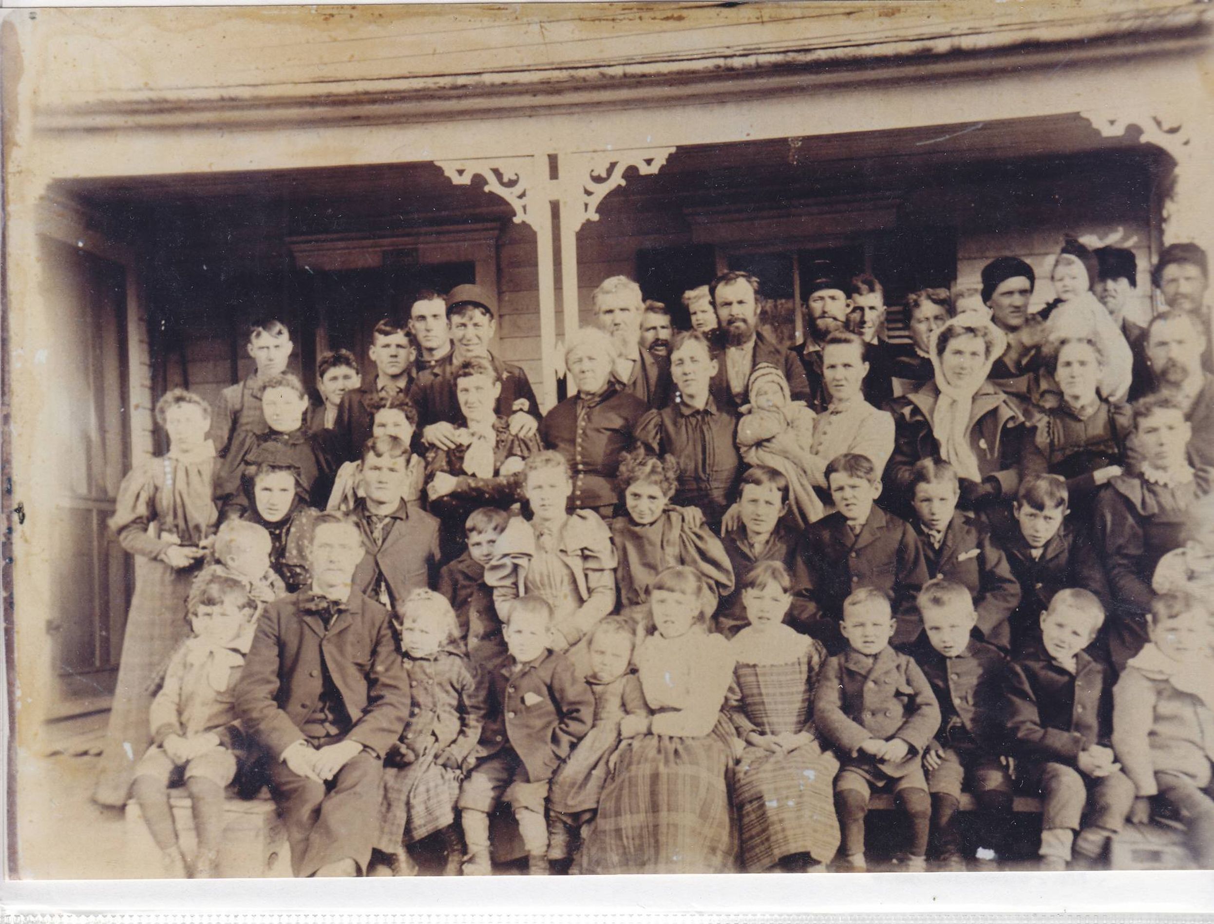 Large group photo of people dressed formally in old traditional clothing