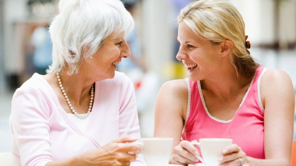 Smiling woman having coffee