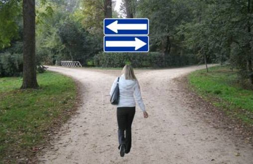 woman walking toward crossroad