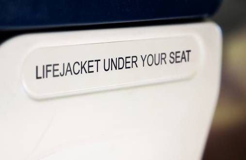 lifejacket sign on back of airline seat