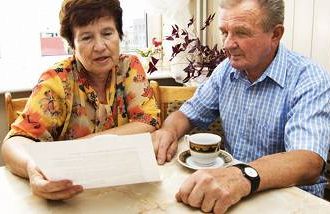 An older couple looking over their Social Security benefits. 