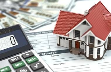 Calculator, money, house and real estate documents