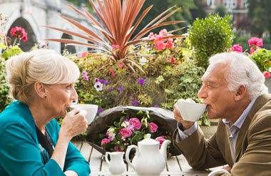 Couple drinking tea outside