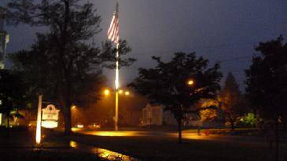 flagpole at night in newtown, ct 