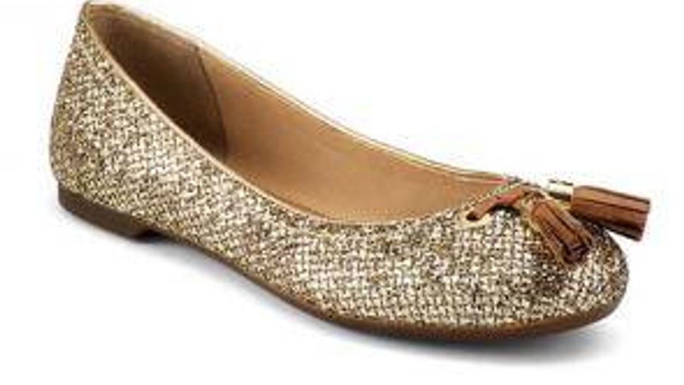 Preppy yet polished, Sperry topsider with gold glitter and leather tassels