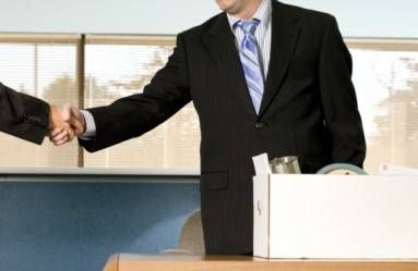 businessman shaking hands before packing up office
