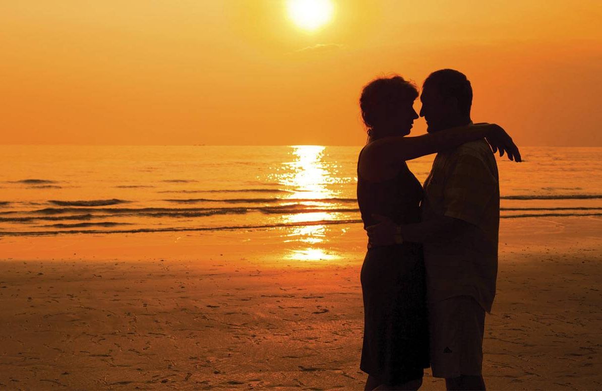 Couple embracing at the beach