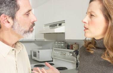 Mature couple arguing in kitchen