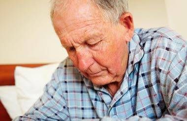 Elderly man struggling with illness. 
