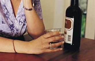 woman drinking wine alone