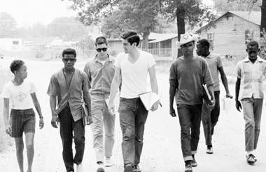 Freedom Summer volunteers and locals canvassing.