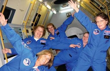 adults at a space camp simulating gravity-free space 