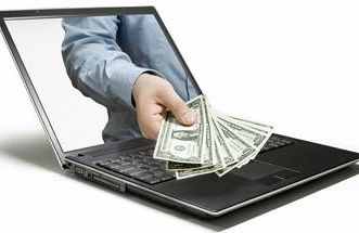 a hand coming out of a computer with cash