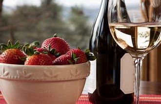 Wine and strawberries are some anti-aging foods for women over 50.