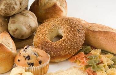 Image of high glycemic carb foods like bagel, potatoes, rice, pasta