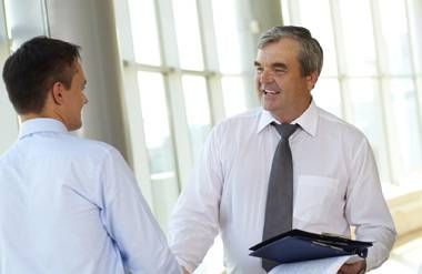 Man networking in person with other people