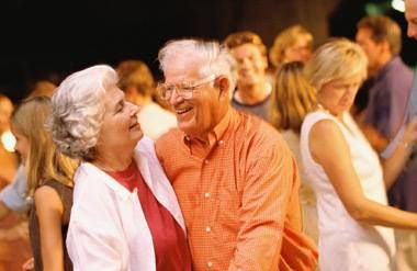Couple dancing in a crowd