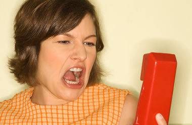 Woman screaming into telephone