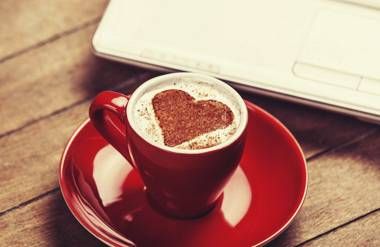 Coffee cup with coffee heart design