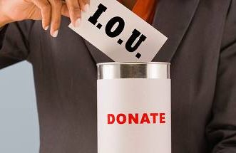 a woman putting an i.o.u. into a donation can