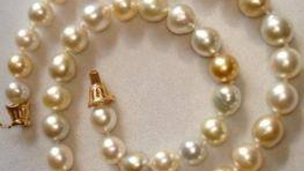 varied hues of gold, cream and white oval-shaped pearls