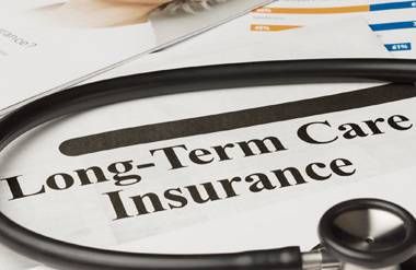 Long-Term Care Insurance paperwork and stethoscope