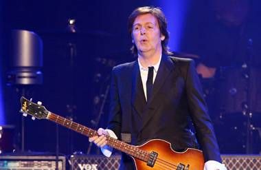 Sir Paul McCartney performs on stage during his 2013 'Out There' tour