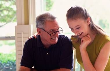 Father and daughter looking at finances