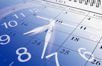 A clock overlaid on a calendar symbolizing time management. 