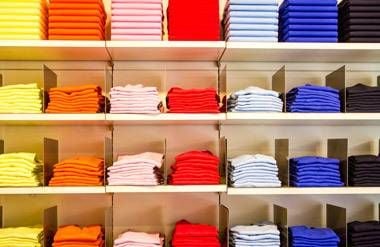 Shelves of shirts in a store