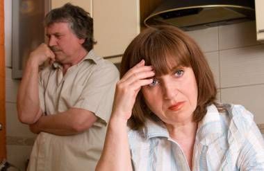 Angry divorced couple in kitchen