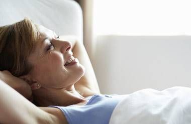 mature woman waking up in the morning