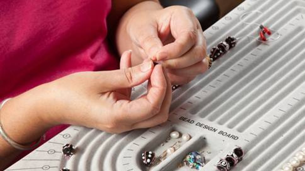 Woman creating jewelry