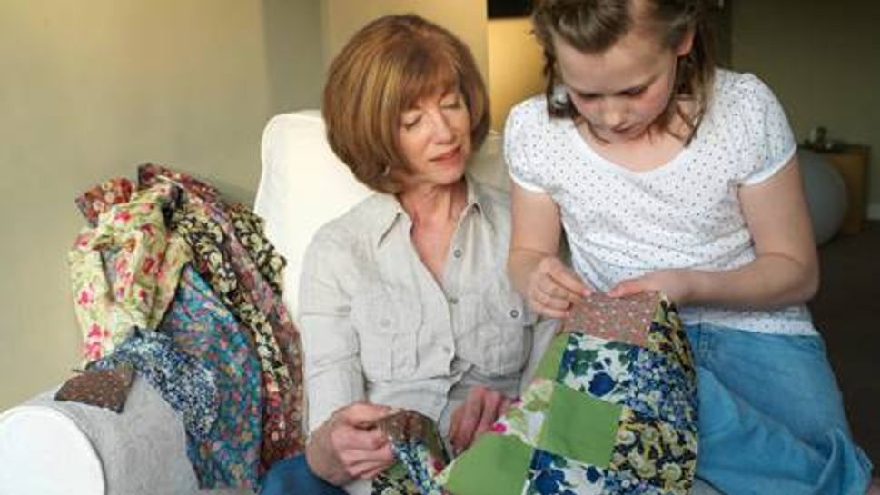 Woman and grandchild quilting