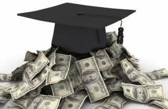 a graduation cap on top of cash