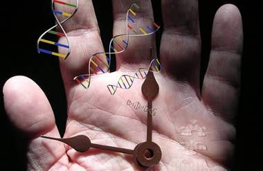 a man's hand with a clock and dna code 