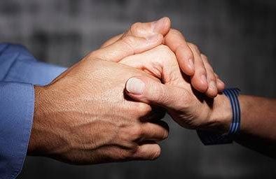 Person holding another person's hand