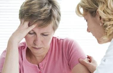 Woman consoling stressed woman