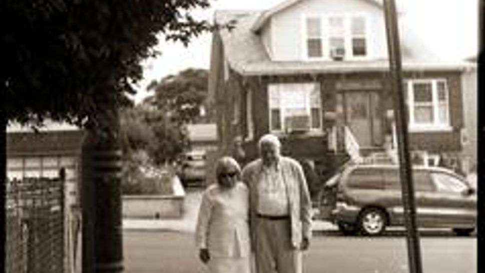 mary and joe white standing on the street