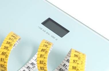 Tape measure resting on a scale