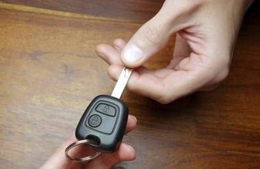 Person taking car keys away from another person